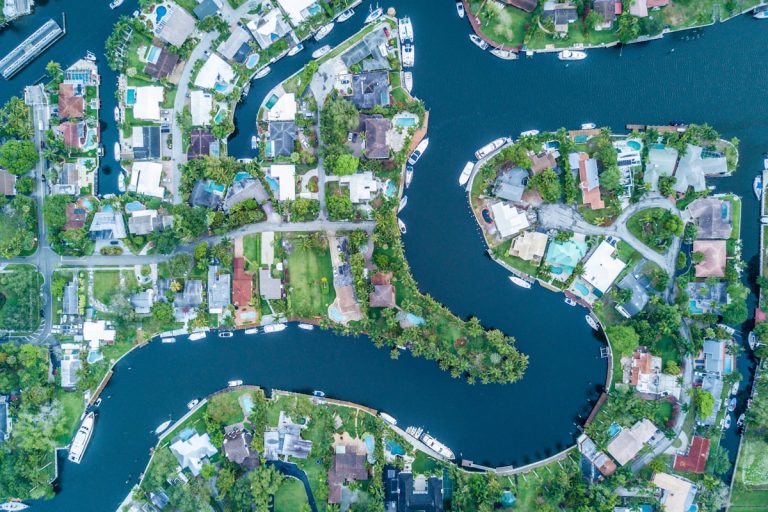 A canal with boats and houses in Cape Coral, Florida.